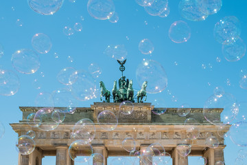 Brandenburg Gate / Brandenburger Tor on sunny day with blue sky and soap bubbles