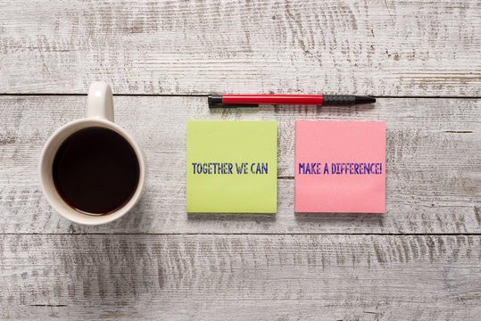 Text sign showing Together We Can Make A Difference. Business photo text be very important some way in like team or group Stationary placed next to a cup of black coffee above the wooden table