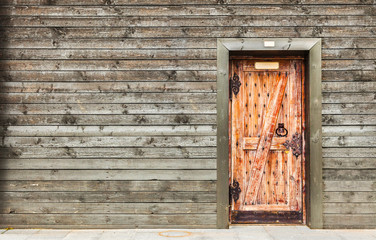 Log house wood wall with wooden door