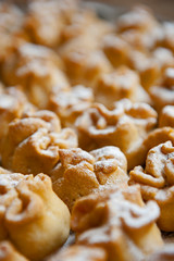 Homemade biscuit with violet hyacinth, white flower and yellow taraxacum on the wooden table