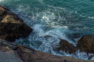 waves crashing on rocks