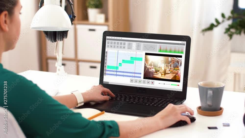 Poster technology, post production and vlog concept - woman working in video editor program on laptop compu