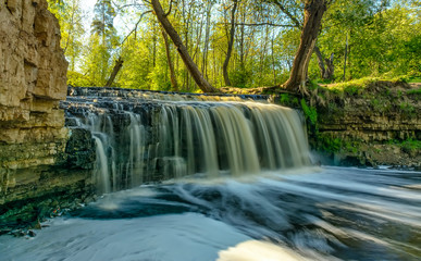 Waterfall on the river Sablinka in the village of Ulyanovsk, Leningrad region.
