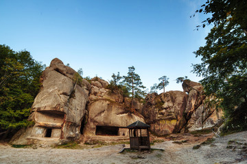 an ancient stone settlement. Unusual rock outcrops in nature reserve. Dovbush rocks, Ivano-Frankivsk region. Horizontal outdoors shot.Rocks and forest among the rocks. miracle of the world
