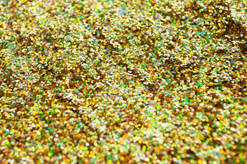 gold glitter is scattered. background. brilliance