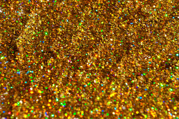 gold glitter is scattered. background. brilliance