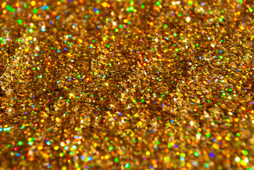 gold glitter is scattered. background. brilliance