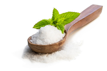 Wooden spoon with sea salt isolated on white