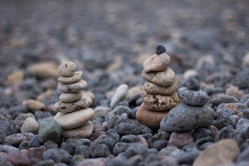 Fototapeta na wymiar Three zen stone piles and pebbles.