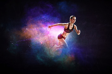 Obraz na płótnie Canvas Fast running young woman. Mixed media