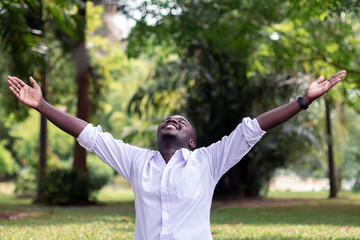 Emotional african  man laughing in wind