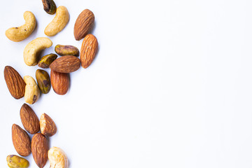 Almonds and nuts on white background