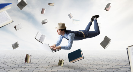 Smiling joyful levitating young man. Mixed media