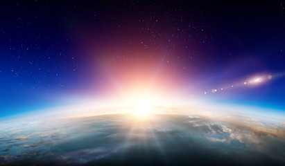 Earth with sunrise on blue space background