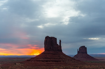 Sunrise over the famous mitten and merrick buttes of Monument Valley