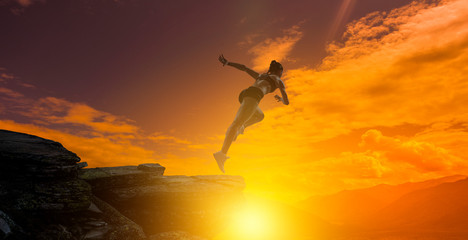Jumping over precipice, challenge concept.