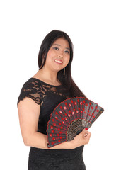 Smiling Chinese woman in a black dress and fan