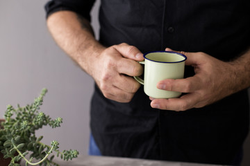 man holding a coffee