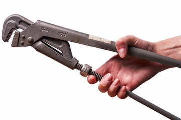 Girl holding a plumbing key isolated on a white background