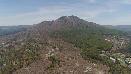 Fototapeta na wymiar Aerial view volcano batur covered with vegetation mountain landscape with volcano sky and clouds Bali, Indonesia. Travel concept.