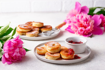 Obraz na płótnie Canvas Homemade donuts with rose jam