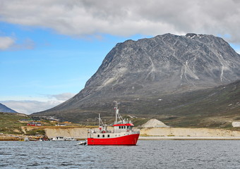 Boat and landscapes of Greenland, Nuuk fjord, ocean with mountains background