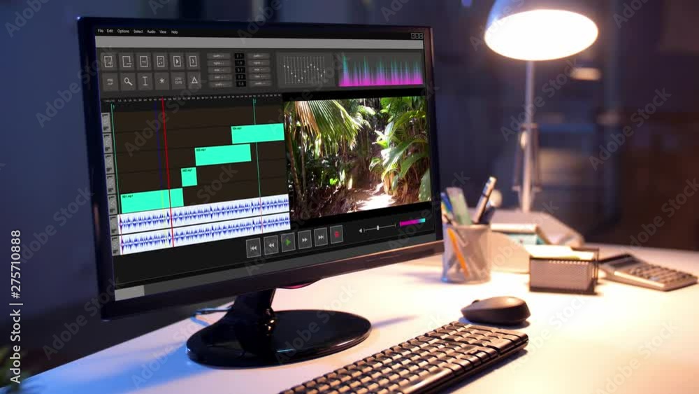 Poster post production, deadline and technology concept - travel video playing in editor program on compute