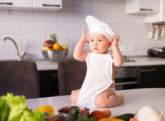  little boy, white chef hat, vegetables