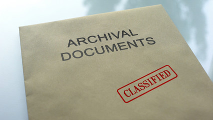 Archival documents classified, seal stamped on folder with documents, close up