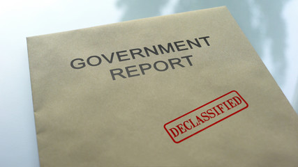 Government report declassified, seal stamped on folder with important documents