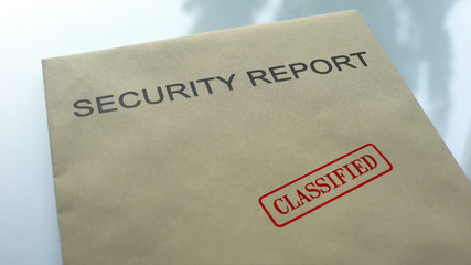 Security report classified, seal stamped on folder with important documents
