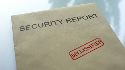 Security report declassified, seal stamped on folder with important documents