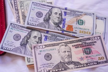 Money from america. Notes of Real, USA Dollars currency. Concept of economy, inflation and business. Wallet with money banknotes and Coin. 