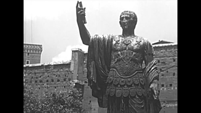 The bronze cast statue of Marco Cocceio Nerva Caesar Augustus, Roman emperor in Imperial Forums road of Rome city. BW historical archival of in Roman Forum. Rome capital of Italy in the 1960s.