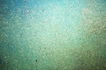 Fototapeta na wymiar Messy underwater particles texture close up