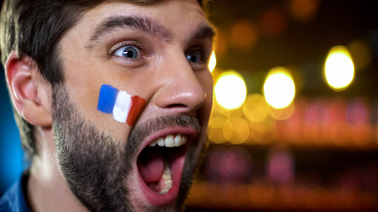 Extremely emotional french fan screaming, celebrating national team victory
