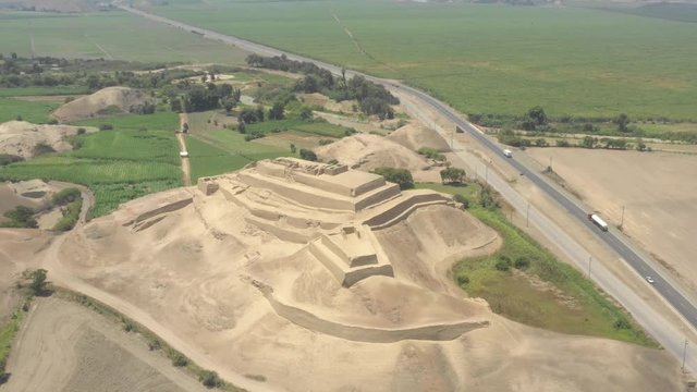Pullback and tilt up of Paramonga prehispanic fortress, in Paramonga, Lima, Peru