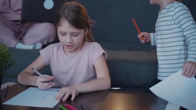 Attractive and small kids drawing picture to they mother