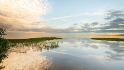 Reflections on the becalmed waters of Lough Neagh, County Armagh, Northern Ireland 