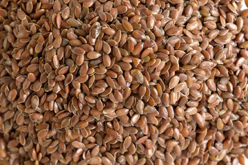 Horizontal texture and brown flax-seed background. 