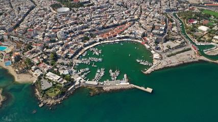 Aerial drone view of iconic round shaped picturesque port of Mikrolimano with sail boats and yachts...