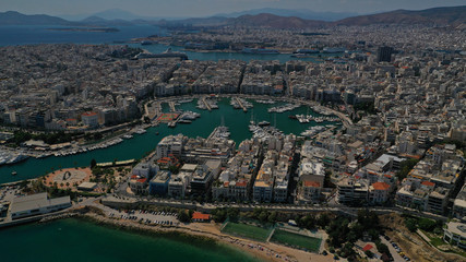 Fototapeta na wymiar Aerial drone panoramic photo of famous port round port of Mikrolimano and Zea or Passalimani with luxury yachts docked and famous port of Piraeus as seen from great altitude, Piraeus, Attica, Greece
