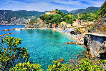 Cinque Terre village of Monterosso, Italy. View of the village over the brilliant blue sea.