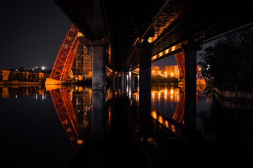reflection of the bridge at night in the city