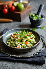 Lebanese Tabbouleh salad with bulgur, parsley, mint, tomatoes and seasoning