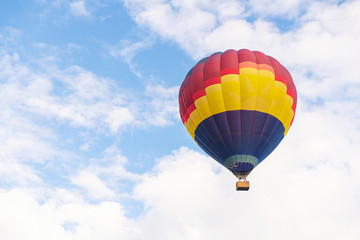Colorful hot air balloon floating under blue sky