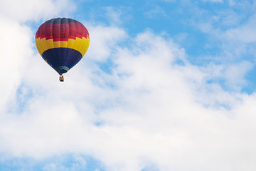 Colorful hot air balloon floating under blue sky