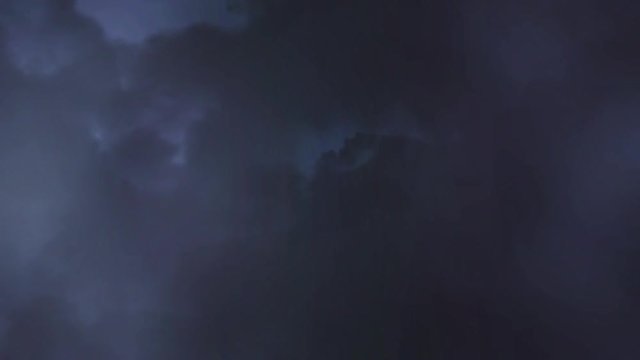 Stormy night sky with flashes of lightning