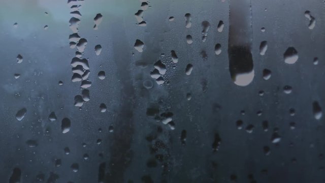 Foggy window with moisture and water droplet