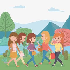beautiful women walking in the park using smartphones